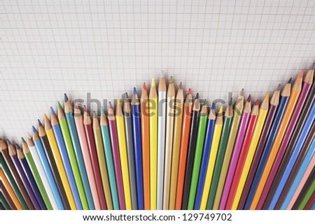 Several colored pencils lined up forming a graph.