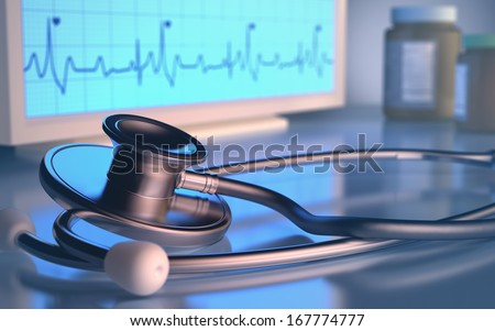 Stethoscope in front of the heartbeat monitor.