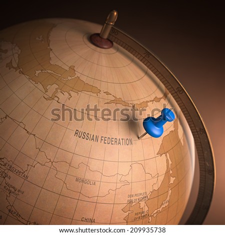 Antique globe with the Russia marked by the pin. Clipping path included.