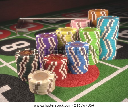 Colorful chips on a green table. Depth of field on some chips. Clipping path on the chips.