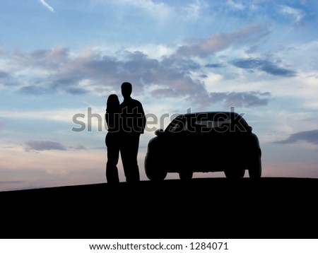 Couple beside the car (silhouette).