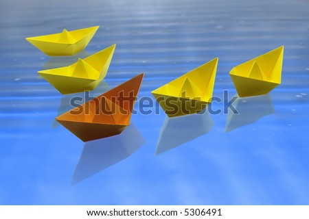 The ship orange is in the leadership in relation to the yellow ships. That is a leadership concept for a lot of things in the life.
