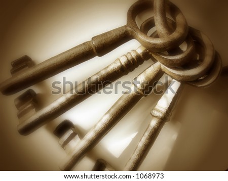Set of four oversized, cast iron antique keys on a ring.