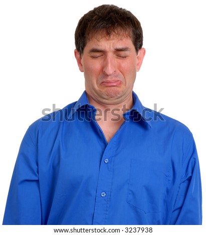 stock photo Man in blue dress shirt looking sad or disgusted