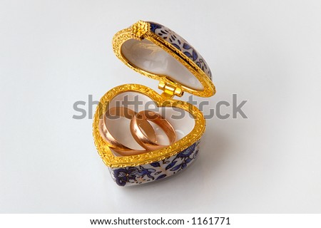 stock photo Casket small box with golden wedding rings on white 