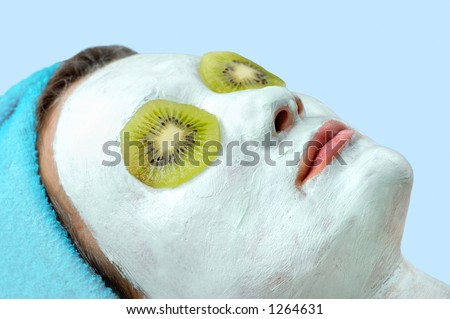 Blue thermal mud face pack on woman face