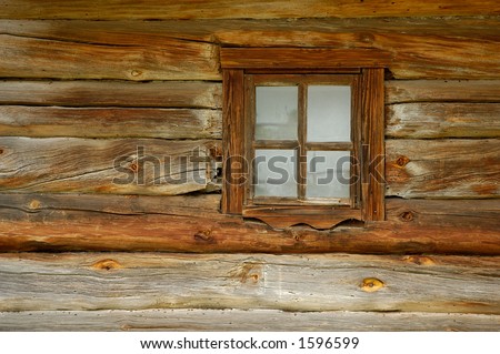 Ancient window on log house wooden wall background texture