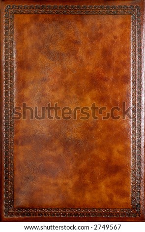 Brown leather book cover with decorative pattern