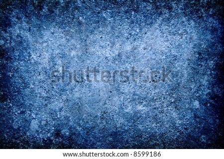 Grungy colored in blue concrete wall closeup background texture