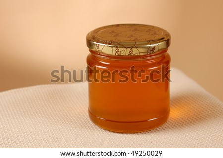 Honey jar on table