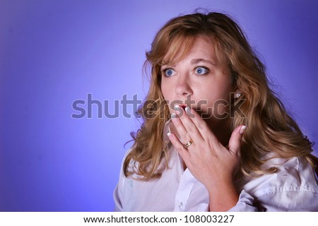 Woman looking surprised or shocking expression. Isolated by a lavender background.Showing manicure.