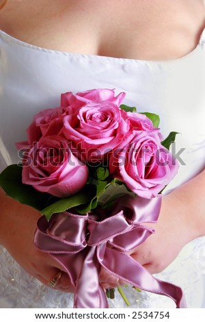 close up of brides bouquet. Beautiful colorful roses and lavender ribbon.