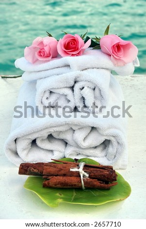 Aromatherapy at a spa setting, using roses , towels and cinnamon sticks