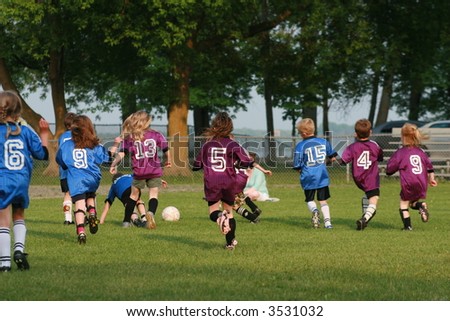 Soccer teams playing in the summer.