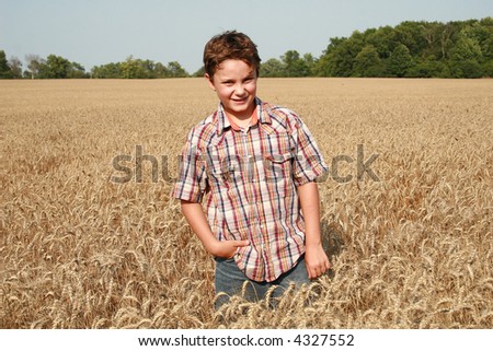 Future farmer in wheat fields