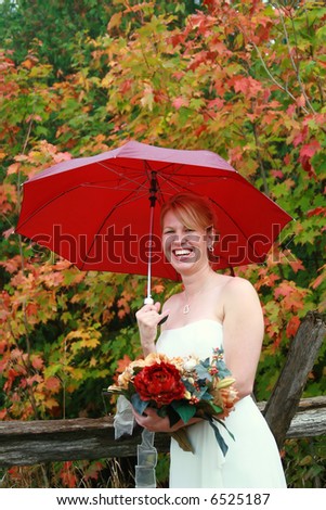 Beautiful bride on her raining wedding day.