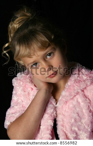 Adorable girl with pink fur coat