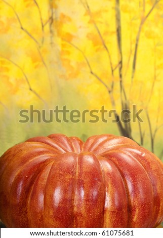 Outdoor fall scene with pumpkin and fall tree leaves