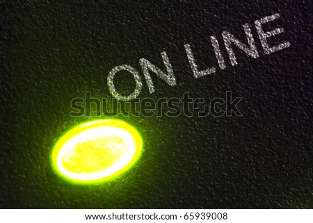 Macro of on line label of modem and lighting green led, abstraction of internet