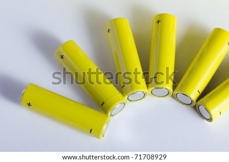 Lot of yellow battery in a row, with positive and negative sign