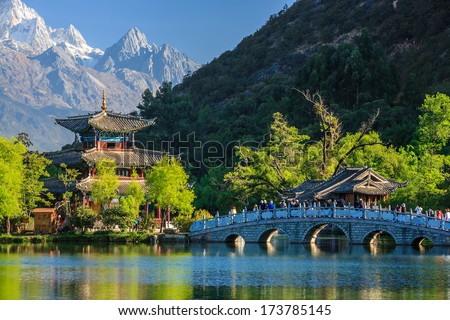 Lijiang old town scene-Black Dragon Pool Park. you can see Jade Dragon Snow Mountain in the background.