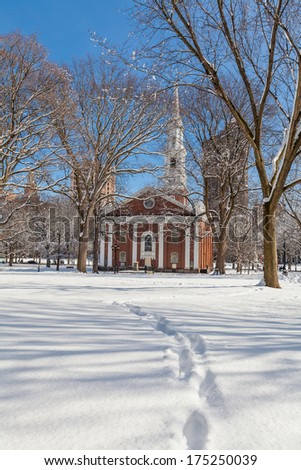 New Haven Green with snow and blue sky: a park in downtown New Haven, CT used for public events and bordered by Yale University. Stock Photo: