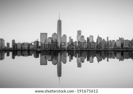 Manhattan Skyline with the One World Trade Center building at twilight, New York City in black and white