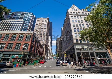 SEATTLE - JULY 5: Downtown Seattle on July 5, 2014. In 1989, building heights in Downtown and adjoining Seattle suburbs were tightly restricted following a voter initiative.