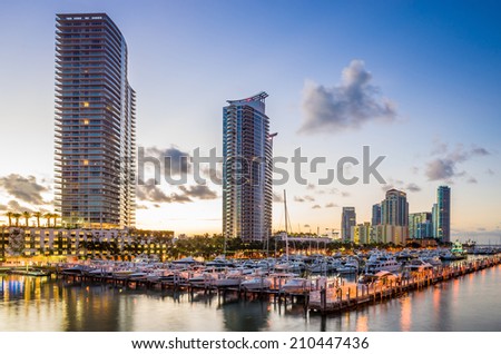 Miami south beach street view with water reflections at night and the marina