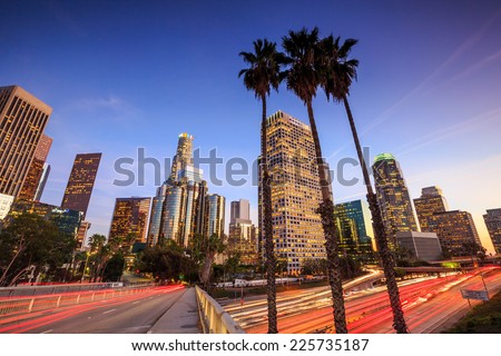 Downtown Los Angeles skyline during rush hour at sunset