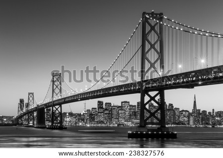 San Francisco skyline and Bay Bridge at sunset in black and white
