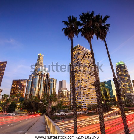 Downtown Los Angeles skyline during rush hour at sunset