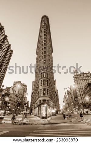 NEW YORK CITY - FEB 11: Flat Iron building, considered to be one of the first skyscrapers ever built, with New York City street view. February 11, 2015 in Manhattan, New York City.