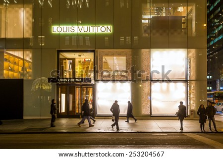 NEW YORK CITY - FEB 11: Shopping street at 5th Avenue in NYC with tourists on  February 11, 2015. It is considered among the most expensive and best shopping streets in the world.