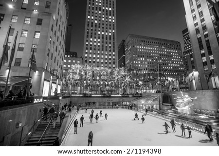 NEW YORK CITY - FEB 11: Ice skaters and tourists are all around the famous Rockefeller Center  during the holidays on February 11, 2015 in Manhattan, New York City.