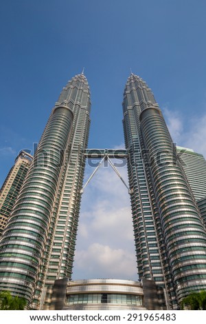 KUALA LUMPUR, MALAYSIA - June 25: Petronas Twin Towers on June 25, 2015 in Kuala Lumpur, Malaysia. Petronas Towers are twin skyscrapers and were tallest buildings in the world until 2004