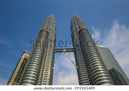KUALA LUMPUR, MALAYSIA - June 25: Petronas Twin Towers on June 25, 2015 in Kuala Lumpur, Malaysia. Petronas Towers are twin skyscrapers and were tallest buildings in the world until 2004
