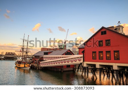 Boston Harbor and Financial District at sunset and Tea Party Ships & Museum in Boston, Massachusetts.
