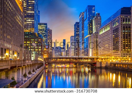 Chicago downtown and Chicago River at night in USA.