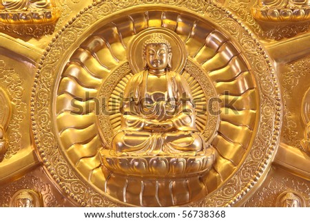 Portrait of a golden Chinese style Buddha statue Thailand