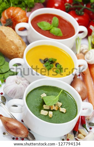 Three traditional soups (tomato, pumpkin and  spinach). Traffic light concept
