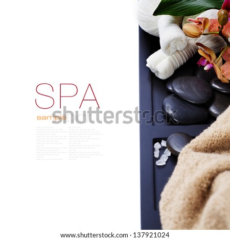 spa concept (zen stones, Herbal massage balls and towel) over white (with easy removable sample text)
