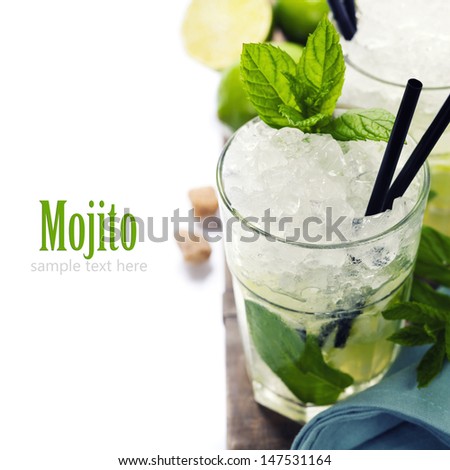 Mojito cocktail with ingredients on wooden background with sample text Mojito cocktail with ingredients on wooden background with sample text