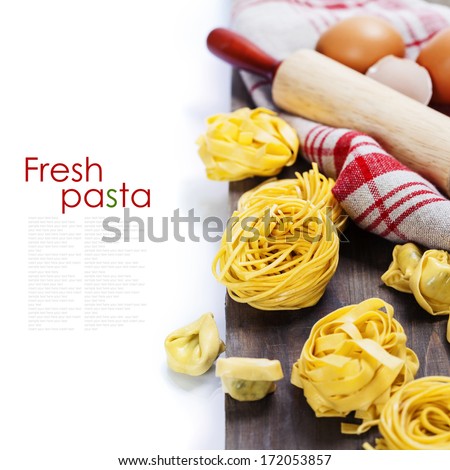 Making homemade pasta on wooden table (with easy removable sample text)