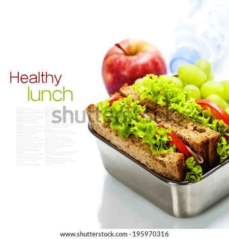Lunch box with sandwiches, fruits  and water on white background