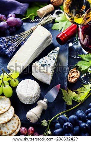 Food background with Wine, cheese and Grape.