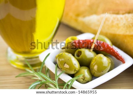 Green olives, olive oil, fresh bread and herbs