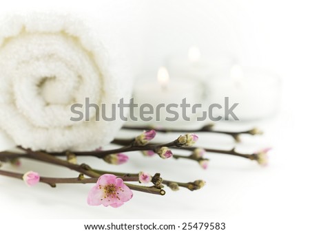 Delicate spring cherry blossoms with towels in a zen spa atmosphere