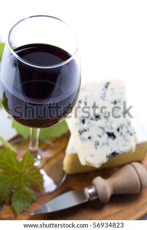 Still life with red wine and cheese