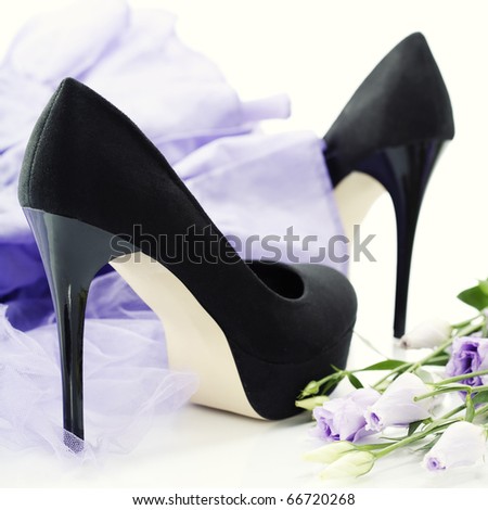 Black women shoes, flowers and dress over white